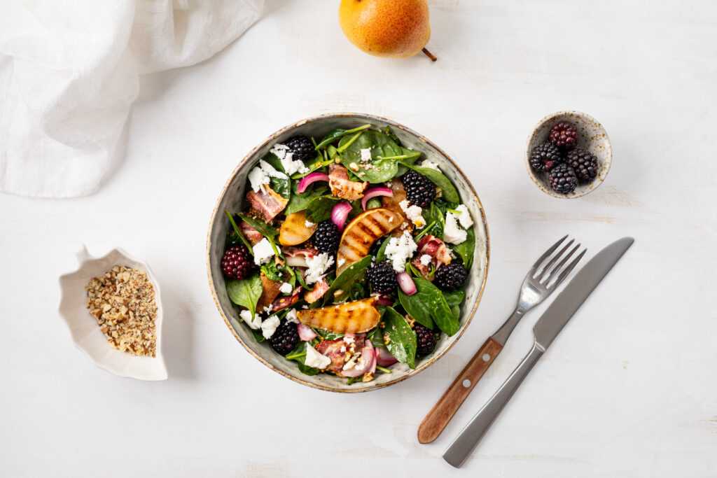 grilled pear, toasted bacon, blackberries and nuts in a delicious baby spinach salad